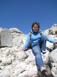 SX03556 Jenni climbing down rocks.jpg